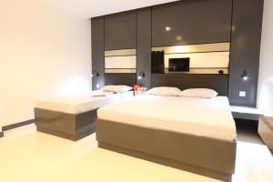 Postel nebo postele na pokoji v ubytování Hotel Sogo San Jose Del Monte, Bulacan