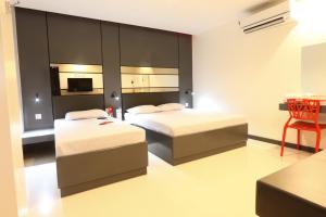 Postel nebo postele na pokoji v ubytování Hotel Sogo San Jose Del Monte, Bulacan