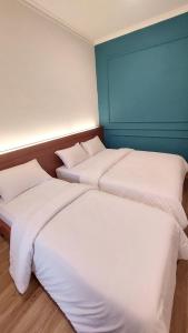 Ένα ή περισσότερα κρεβάτια σε δωμάτιο στο Riche Heritage Hotel