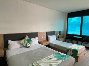 Postel nebo postele na pokoji v ubytování Jasper Motor Inn