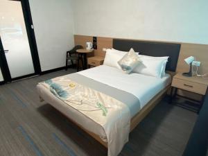 Postel nebo postele na pokoji v ubytování Jasper Motor Inn