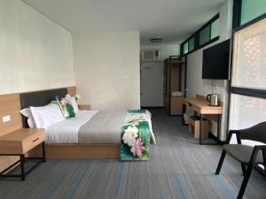 Postel nebo postele na pokoji v ubytování Jasper Motor Inn