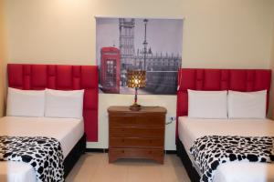 Voodi või voodid majutusasutuse Hotel 50 Suites toas