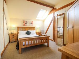 a bedroom with a bed and a skylight at The Mill House in Shrewsbury