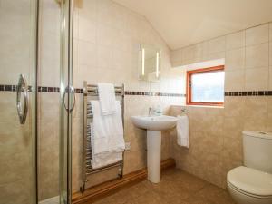 a bathroom with a shower and a sink and a toilet at The Mill House in Shrewsbury +65 photos