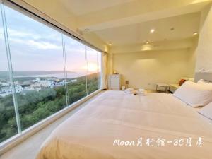Letto o letti in una camera di Moon月行館海景民宿