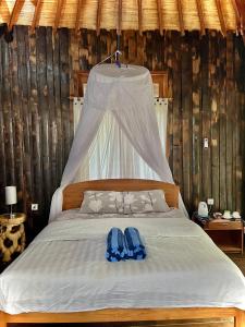 Postel nebo postele na pokoji v ubytování Bronze Bungalows