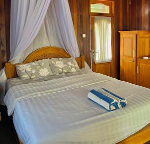 Postel nebo postele na pokoji v ubytování Bronze Bungalows