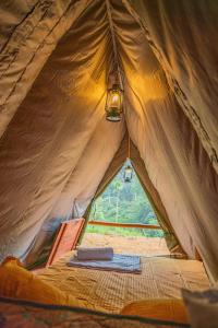 a tent with a light inside of it at Bambara Ella Agro Resort & Camping in Haputale