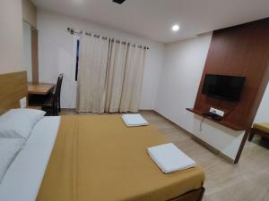 Voodi või voodid majutusasutuse Nandan Residency toas