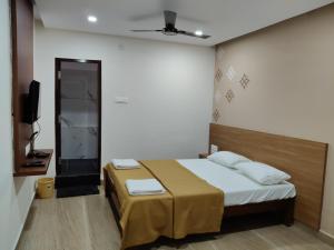 Voodi või voodid majutusasutuse Nandan Residency toas