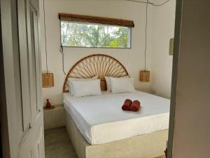 Voodi või voodid majutusasutuse Surf Lodge Madiha toas