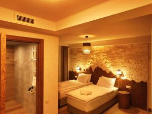 Letto o letti in una camera di Hotel Ushba in Mestia