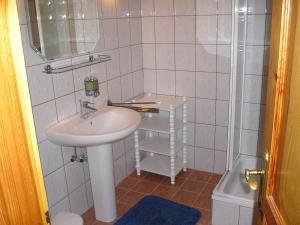a small bathroom with a sink and a shower at Villa Jäger in Vonyarcvashegy +48 photos