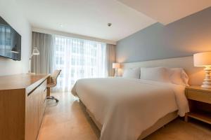 Кровать или кровати в номере Radisson Cartagena Ocean Pavillion Hotel