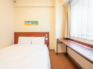 Postel nebo postele na pokoji v ubytování Comfort Inn Fukui