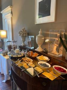 a buffet with many plates of food on a table at Six Brunton Place Guest House in Edinburgh