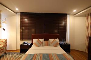 Hotel Natraj Rishikesh客房内的一张或多张床位
