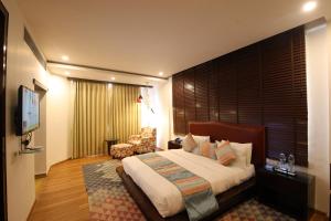 Hotel Natraj Rishikesh客房内的一张或多张床位