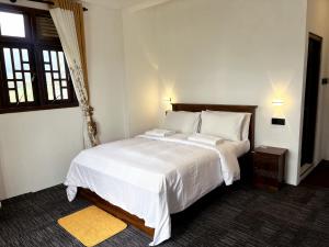 Giường trong phòng chung tại AGP home