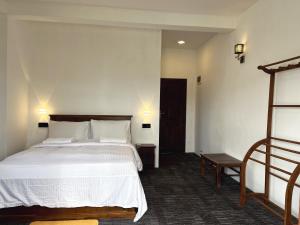 Giường trong phòng chung tại AGP home