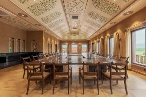a large conference room with a long table and chairs at AamaGhati Wildlife Resort, Ranthambore in Sawāi Mādhopur +145 photos