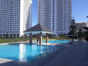 a swimming pool with a gazebo in a city at Casa Angelica in Tagaytay