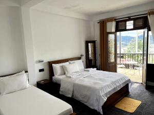 Giường trong phòng chung tại AGP home