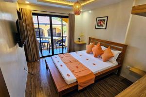 Postel nebo postele na pokoji v ubytování Villa Naranja Pagudpud - Biondo + 27 fotografií