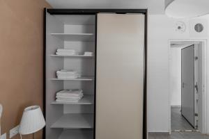 a mirror in a bathroom with white towels at Blueground Florentine, City view in Tel Aviv +64 photos