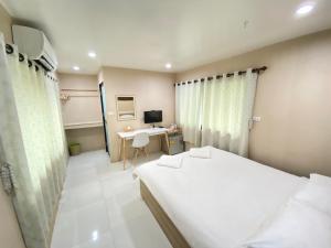 Postel nebo postele na pokoji v ubytování Guesthouse 88 Phang Nga