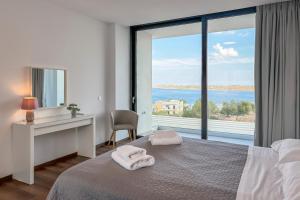 A bed or beds in a room at Villa Valentina Chania