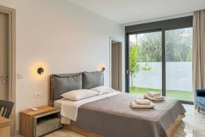 A bed or beds in a room at Villa Valentina Chania