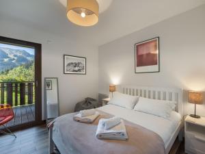 Ένα ή περισσότερα κρεβάτια σε δωμάτιο στο Les 4 Elements - Apt B01 - BO Immobilier- Reduced prices on ski passes Châtel & Portes du Soleil