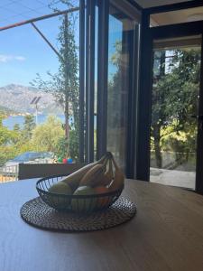 a bowl of bananas sitting on top of a table at Maslina- 3 bedroom apartment in Kotor