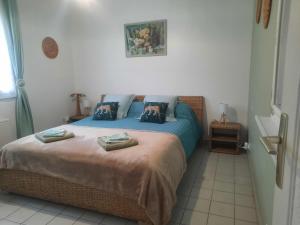 Posteľ alebo postele v izbe v ubytovaní GITE CHEZ MONETTE