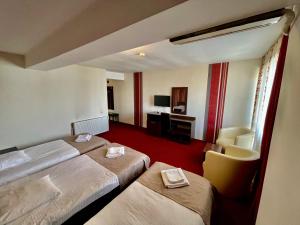 Postel nebo postele na pokoji v ubytování Hotel City