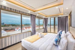 Un pat sau paturi într-o cameră la Mermaid Beach Resort +66 fotografii