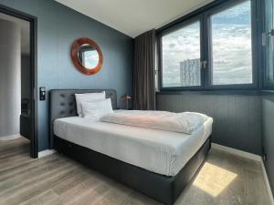 Ένα ή περισσότερα κρεβάτια σε δωμάτιο στο Suites im Cloud
