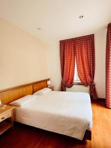 Postel nebo postele na pokoji v ubytování Gorizia Inn