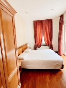 Postel nebo postele na pokoji v ubytování Gorizia Inn