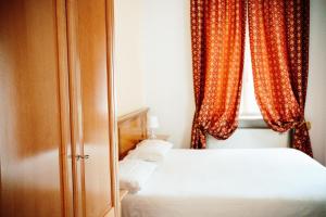 Postel nebo postele na pokoji v ubytování Gorizia Inn