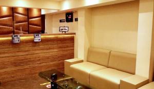 a waiting room with a couch and a table at RSVP Nagpur in Nagpur