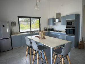 Η κουζίνα ή μικρή κουζίνα στο Superbe penthouse sur la plage