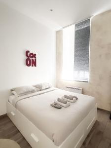 Een bed of bedden in een kamer bij Le Petit Cocon - Pause douceur
