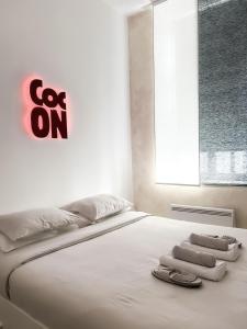 Een bed of bedden in een kamer bij Le Petit Cocon - Pause douceur