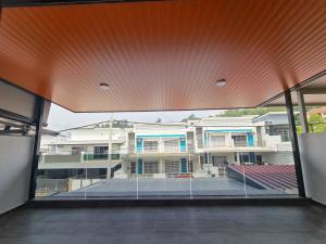 a view of a building from the inside of a building at Shervio Home Bentong in Bentong
