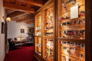 a room with a wall full of knick knacks at Hotel Křížový vrch in Jeseník