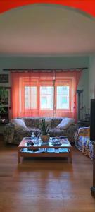 a living room with a table and a couch at La Casita b&b in Bagnoregio