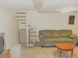 a living room with a couch and a table at Sea Breeze - W007 Brought to you by GetAway Vacations in Wells